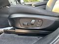 Close-up of a BMW X3 seat adjustment panel featuring buttons for seat height and memory settings