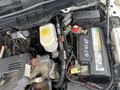Engine compartment of a 2011 Dodge Ram 5500 featuring a battery coolant reservoir and various electrical components