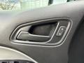 Interior door handle of a 2018 Chevrolet Colorado with a lock button next to it