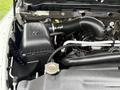 A close-up view of the engine compartment of a 2013 RAM 3500 featuring the air intake system and engine components