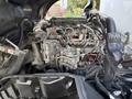 The image shows the engine bay of a 2014 Hino 195 with various components including hoses pipes and mechanical parts arranged visibly