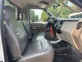 Interior of a 2009 Ford F-450 Super Duty showing leather bench seats and dashboard with various controls and features
