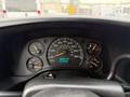 Dashboard of a 2004 Chevrolet Express displaying speedometer fuel gauge and odometer showing 113164 km