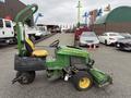 A 2009 John Deere 2653B Precision Diesel Mower featuring a yellow seat and multiple cutting decks with a green chassis showcasing wear and usage