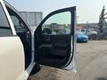 A 2017 Chevrolet Silverado 1500 with the driver's side door open showcasing the interior and door panel details