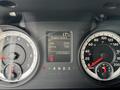 Dashboard of a 2013 RAM 1500 showing gauges for speed, fuel, engine hours, and a digital display for idle and drive information