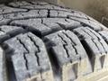 Close-up of a tire tread on a 2010 Mercedes-Benz Sprinter showing deep grooves and rugged surface designed for traction