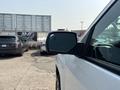 A side view of a 2017 Chevrolet Silverado 1500 showing the driver’s side mirror and part of the vehicle's body