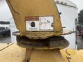 A warning label on a 2010 Vermeer Corporation BC1000XL chipper features safety instructions about thrown chips and the need for eye protection