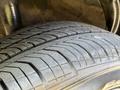 Close-up of a tire showing detailed tread patterns and tire branding on a 2018 Kia Rio5