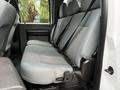 Interior view of the rear seats in a 2016 Ford F-550 Super Duty with gray fabric upholstery and seatbelts