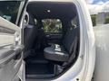 Interior view of a 2021 RAM 5500 showing the backseat area with gray fabric seats and a clean, spacious layout
