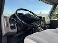 Interior view of a 2011 International WorkStar truck showcasing the steering wheel dashboard and controls