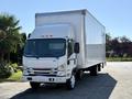 A 2019 Isuzu NRR box truck with a white exterior and a large cargo area in the back