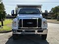 2017 Ford F-650 Super Duty with a white exterior and chrome accents facing forward with large side mirrors and a prominent grille