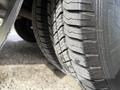 Close-up of two tires from a 2019 Chevrolet Express showing tread patterns and tire sidewalls
