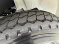 Close-up of a treaded tire from a 2006 International 4200 showing the grooves and patterns of the rubber surface