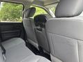 The interior of a 2016 RAM 1500 featuring a rear bench seat with fabric upholstery and headrests