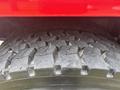Close-up of the rugged tire tread of a 2012 International 7300 Workstar showcasing deep grooves designed for traction and durability
