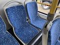 Two blue patterned seats inside a 2016 Grande West Vicinity bus with a focus on the fabric design and shape
