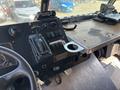 The interior of a 2008 Workhorse W62 showing the dashboard with gauges switches a gear shifter and a cup holder