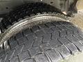 Close-up of the tires on a 2012 Ford Econoline showing the rugged tread design and texture
