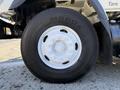 Close-up of a white wheel and tire on a 2008 International 7500 truck showing tire tread and rim details