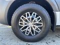 Close-up of a silver alloy wheel and tire of a 2021 Mercedes-Benz Sprinter 2500 showcasing a multi-spoke design with visible tread patterns on the tire