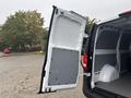 A 2021 Mercedes-Benz Metris with a partially open rear door revealing the interior cargo space