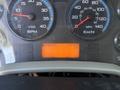 Dashboard of a 2011 International 4300 showing gauges for RPM speed and fuel along with an odometer reading of 145343 KM