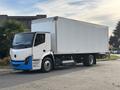 A 2022 Lion Lion6 electric truck with a white cargo box and a blue front bumper is parked on a street