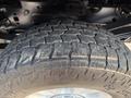 Close-up of a rugged tire from a 2021 Ford F-350 SD showing deep treads designed for traction and durability