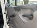 Interior door panel of a 2016 Freightliner M2 106 featuring a black door handle and a window crank positioned near the edge
