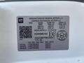 A 2021 Chevrolet Express vehicle identification label displaying manufacturing details and specifications including weight and tire information