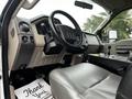 Interior of a 2009 Ford F-550 showing the steering wheel gear shifter and dashboard controls