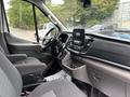 Interior view of a 2020 Ford Transit 250 showcasing the front seats dashboard and infotainment system