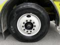 Close-up of a wheel from a 1995 Freightliner FL086 showing a white rim with multiple bolt holes and a black tire with the Continental brand and HSR markings