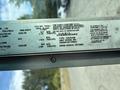 A 2018 Ford Econoline with a tire specifications label displaying details like tire size and pressure limits