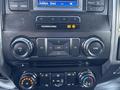 Dashboard controls of a 2017 Ford F-550 including audio and climate controls in a modern vehicle design