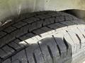 Close-up of a 2022 Mercedes-Benz Sprinter tire showing tread patterns and grooves designed for traction and performance