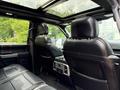 Interior of a 2019 Ford F-150 showing black leather rear seats and headrests with a panoramic sunroof above