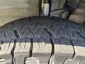 Close-up of a tire tread on a 2020 RAM ProMaster 3500 showcasing deep grooves and a rugged design for traction and stability