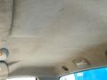 Interior view of a 2009 Dodge Ram 5500 showing the ceiling with fabric material and overhead light fixtures