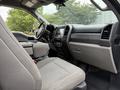 Interior view of a 2020 Ford F-550 showing the driver's seat dashboard and console with controls and a gear shift