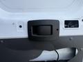 Close-up of a door handle on a 2017 RAM Promaster with a black plastic finish and surrounding metal paneling