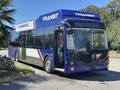 A 2018 Grande West Vicinity bus with a blue and white exterior featuring the word TRANSIT on the front and side