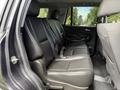 Interior view of a 2017 Chevrolet Tahoe showcasing the back seating area with black leather seats arranged for three passengers