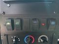 Control panel switches including heated mirrors and a USB port on a 2020 Freightliner MT45 dashboard