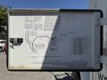 A detailed electrical schematic diagram mounted on the side of a 2009 International 3000 CE bus showing connections and components