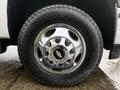 Close-up of a tire with a chrome wheel rim featuring the Chevrolet logo on a 2013 Chevrolet Silverado 3500HD